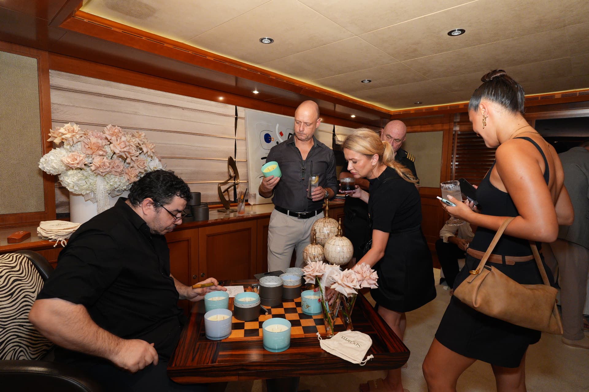 Guests at an MHR candle-making evening aboard a yacht