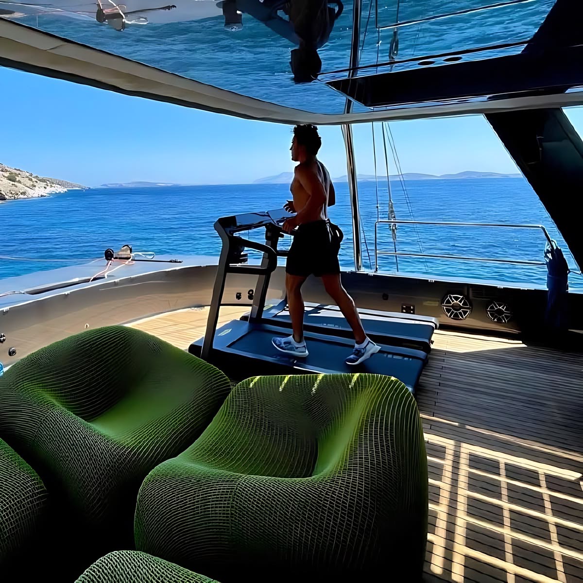 An MHR member training on a treadmill on deck